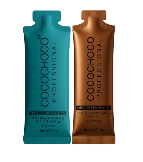 Zwei Haarmaskenpakete von Cocochoco Professional, ein blaues und ein braunes, auf weißem Hintergrund.